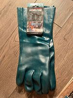 Single pair of green Horizon PVC coated work gloves with original packaging showing size Large.