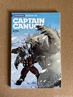 Front cover of Captain Canuck #1 comic book showing Captain Canuck fighting a polar bear in a snowy setting.