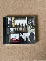 Front cover of the Hootie & The Blowfish 'Cracked Rear View' CD showing album artwork and band silhouettes.