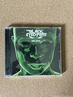 Front cover of The Black Eyed Peas album The E.N.D. showing digital green face artwork.