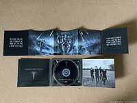 Photo of the opened CD case showing the Vengeance Falls CD, album booklet with artwork and band photo