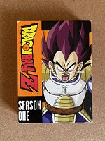Front cover of Dragon Ball Z Season One DVD box set featuring Vegeta in Saiyan armor on an orange and black background.