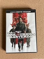 Front cover of Inglourious Basterds DVD case showing main characters and title.