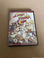 Front cover of Street Fighter Alpha 2 disc special edition DVD featuring animated characters from the movie.