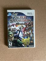 Front view of the Wii Super Smash Bros Brawl game case showing main artwork and title.