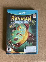 Front cover of Rayman Legends game case for Wii U showing colorful game artwork and title.