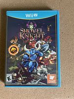Front cover of Shovel Knight Wii U game case showing artwork and branding