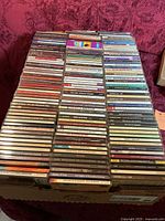 Box containing rows of CD jewel cases