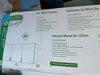 Box showing Mills Pride 54" Wall Cabinet graphic and dimensions