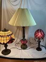 Three vintage table lamps displayed together