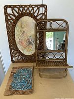 Lot overview showing framed bird print, bentwood mirror rack, and blue bird painting