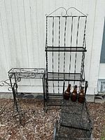 Group shot showing bakers rack, plant stands, tea cart and bottles