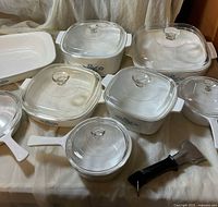 Full set laid out showing various covered dishes and server