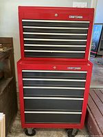 Full view of two-piece Craftsman red rolling tool cabinet on casters