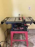 Front view of Craftsman table saw on red stand