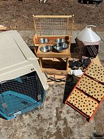 Full lot layout showing kennel, feeders, ramp, gate, carrier and accessories