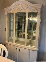 Front view of Ashley Furniture off-white laminate hutch showing entire piece