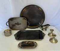 Group shot of all eight silver-plated items