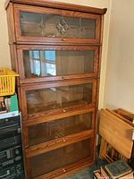 Full view of walnut barrister bookcase showing all five glass-door shelves