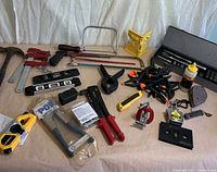 Overview of assorted hand tools laid out on surface