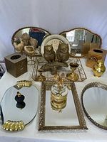 Group shot showing all brass and glass vanity items