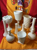 front view shows pitcher, compote, decanters, vases and planter