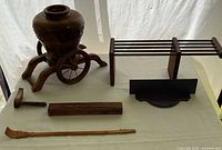 Overview of all wooden items: wheeled urn container, adjustable rack pieces, mallet, block, spatula