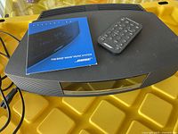 Top view of system with user manual and remote on top