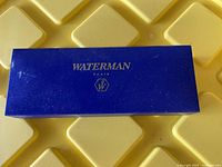 Top view of closed blue Waterman Paris presentation box with gold lettering and logo.