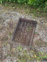 Top view of entire cast iron grate showing size, pattern and condition