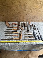 Overall lot with knives, stones and sheath laid out