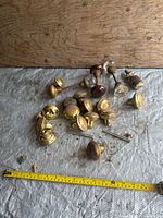 Overview of all door knobs and spindles on tarp