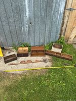 All six drawers, trim board and measuring tape for scale