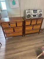 Front view of both wood shelving units with wicker basket drawers