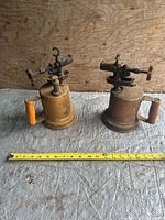 Both blowtorches side by side with tape for scale
