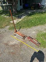 Both hydraulic floor jacks side by side outdoors