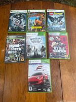 Front view of all seven Xbox 360 game cases
