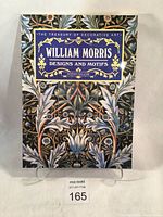 Front cover of the book showing title and decorative floral design