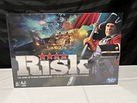 Front of Risk board game box, showing title and artwork with a military figure, with shrink wrap intact.