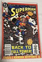 Front cover of Superman comic book issue #50 showing Superman breaking through a brick wall with the title 'Back to Full Power!'