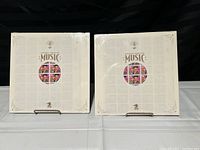 Two unopened Legends of America Music Elvis Presley commemorative stamp sets displayed side by side.