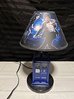 Full view of the Doctor Who lamp showing the TARDIS base and character lampshade