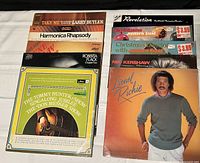 Photo of a selection of record albums including Larry Butler, Roberta Flack, Christmas albums, and Lionel Richie.