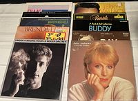 Photo showing record albums including Roger Daltrey, Brenda Lee, Julie Andrews, Marilyn Michaels, Andrew Gold, Jerry Garcia, Buddy Bartók and others.