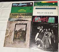 Twenty various artists vinyl albums laid out flat showing cover art and titles including Alice Cooper, Bryan Adams, and Jimi Hendrix