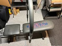 Side view of the Ab King Pro bench showing padded seat and padded arm supports.