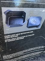 Photo of the box showing the cast iron dutch oven and lid with details on excellent heat retention, even heating, and suitable uses on grill, oven, stove or campfire.