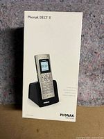 Box of Phonak DECT II cordless phone showing the phone in charging base on front with brand and model visible.