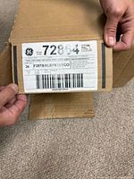 Photo of the box label showing model number F28T8/XLSPX35/ECO, quantity 36, GE brand fluorescent tubes.