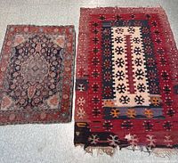 Both kilim rugs laid flat side by side on floor